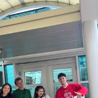 Students posing for a picture on campus GVSU during orientation
